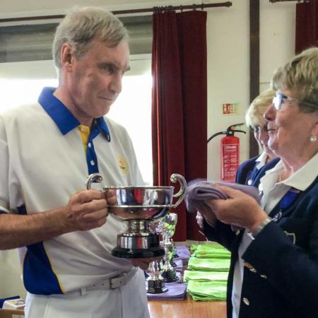 Francis Drake Bowls Club, Hilly Fields, Brockley, SE4 1QE. Rob Warnes being presented with his trophy by organiser Jean Collins